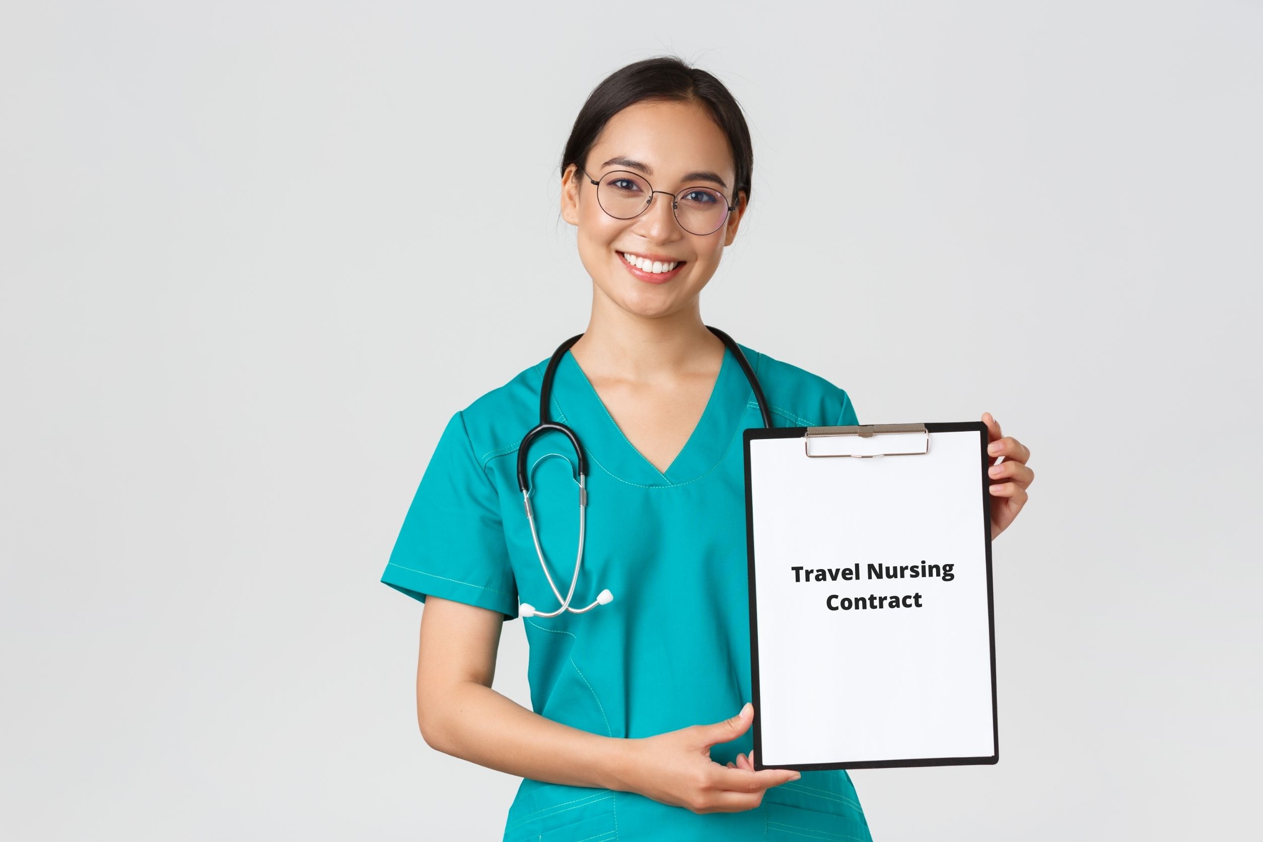 Travel nurse holding board with nursing contract