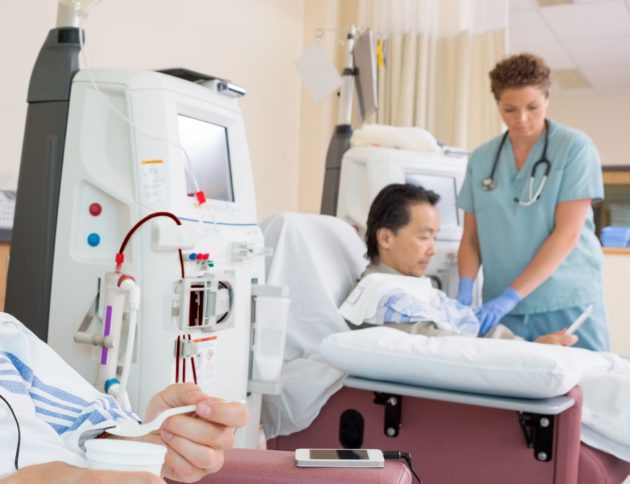 nurse performing emergency dialysis on patient