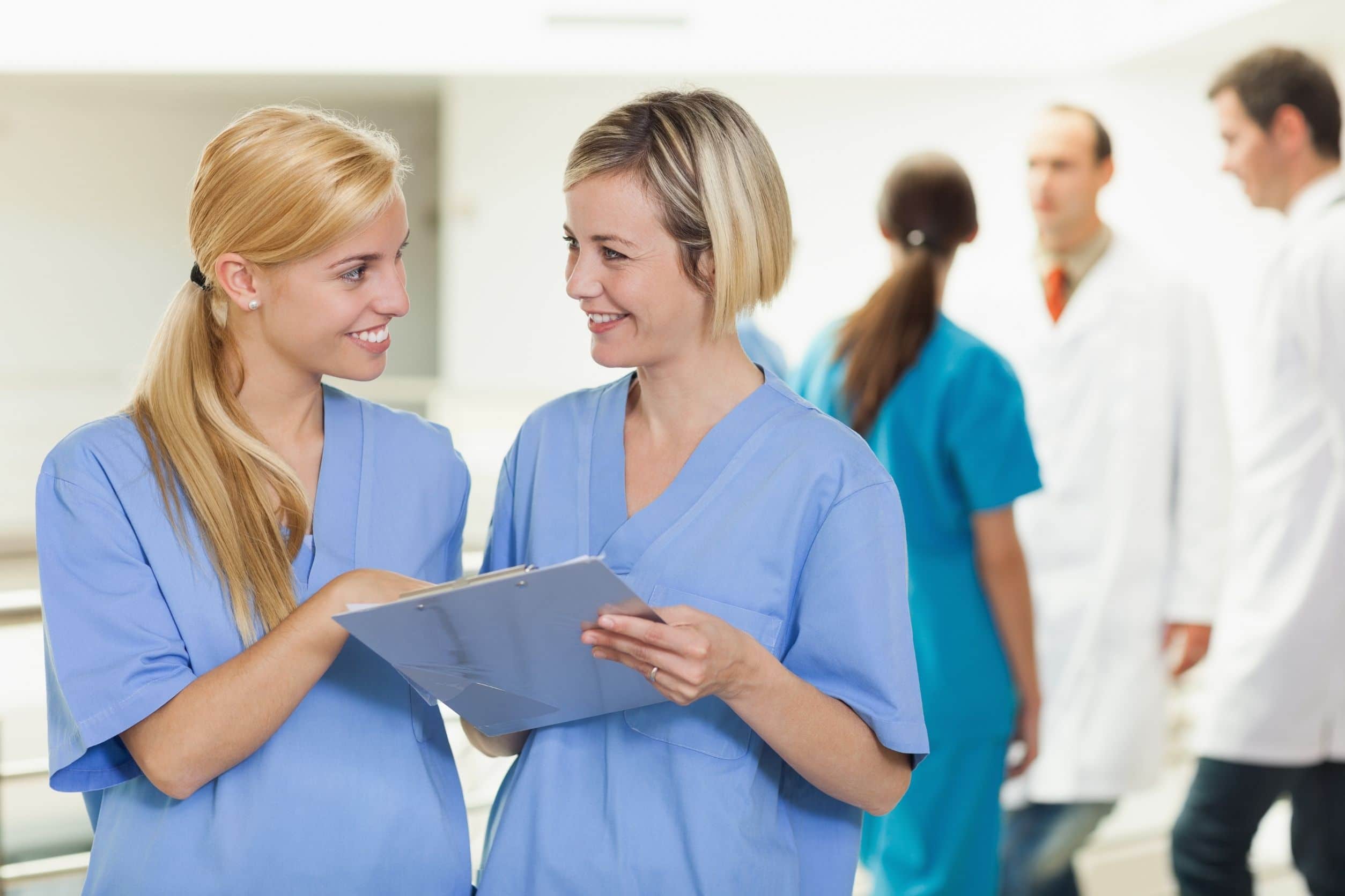 travel nurses using her nursing skills to check a patient's report